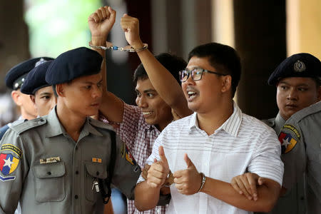 Detained Reuters journalist Wa Lone and Kyaw Soe Oo arrive at Insein court in Yangon, Myanmar August 27, 2018. REUTERS/Ann Wang/Files