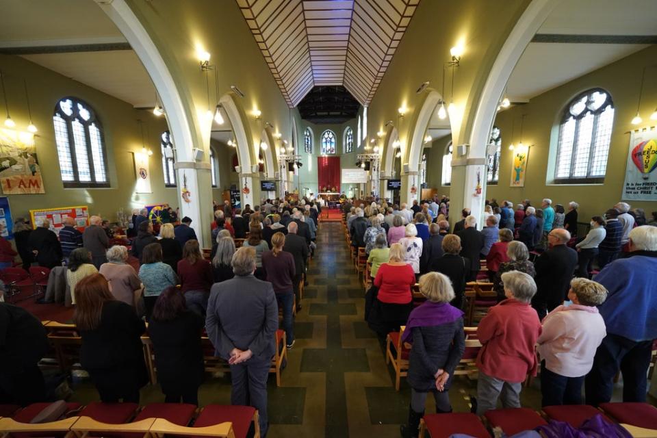 People attend a vigil at St Michael’s & All Angels church (Kirsty O’Connor/PA) (PA Wire)