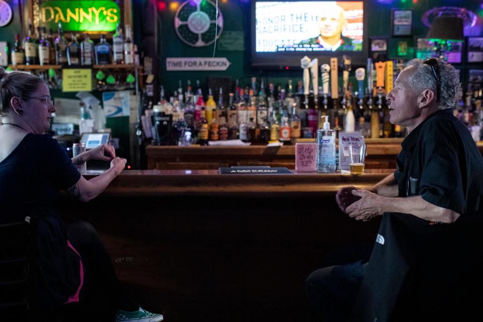 Tom Cole, of Hazel Park, right, talks to Megan Horsfield, of Ferndale, at Danny's Irish Pub in Ferndale on Wednesday, June 28, 2023.