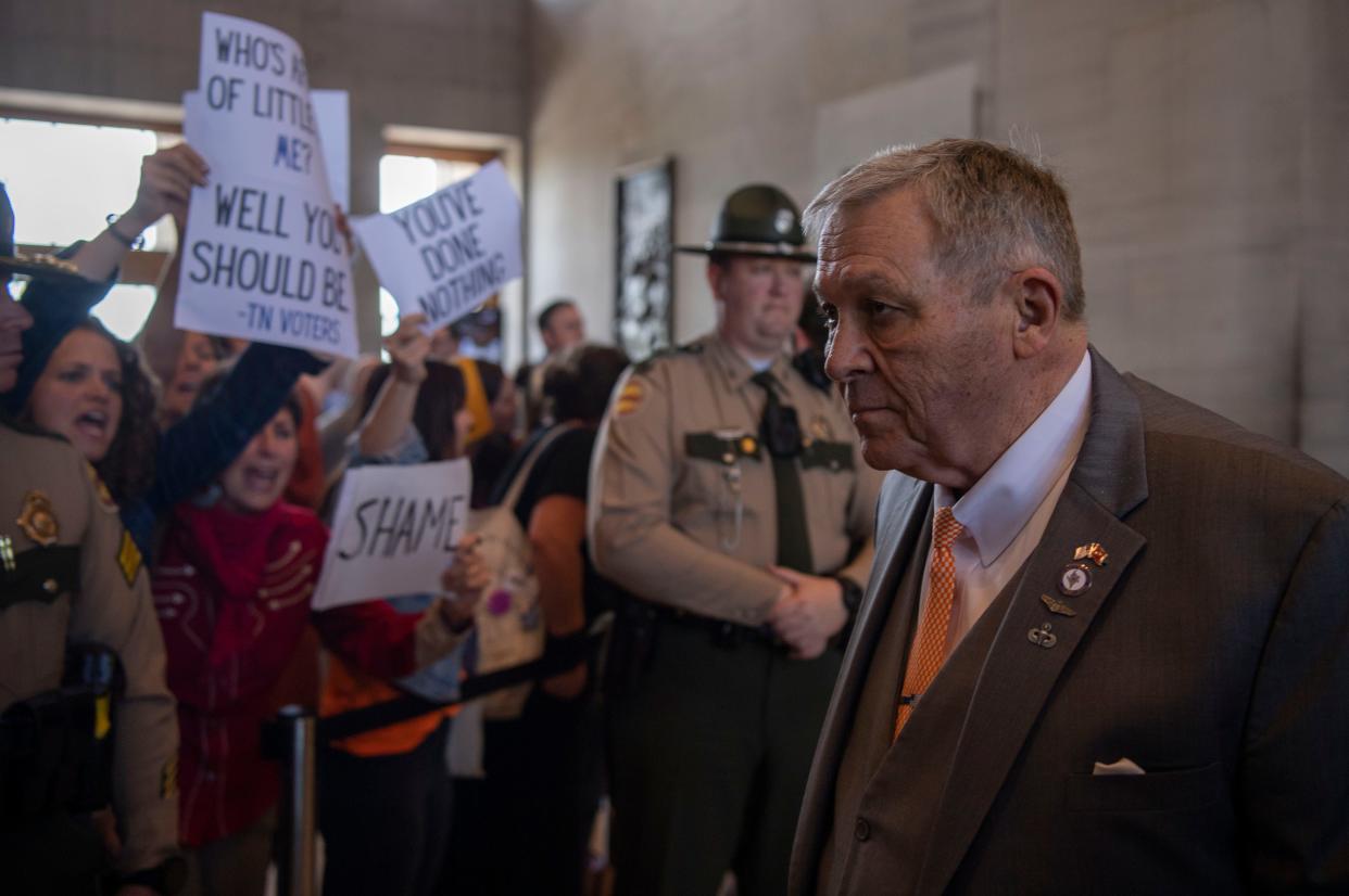 Activists yell “ vote them out” as Rep. John Ragan R- Oak Ridge, leaves the House chamber at the Tennessee Capitol in Nashville, Tenn., Thursday, April 25, 2024.