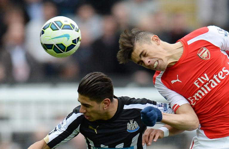 Gabriel Paulista (right) plays for Arsenal against Newcastle at St James Park on March 21, 2015