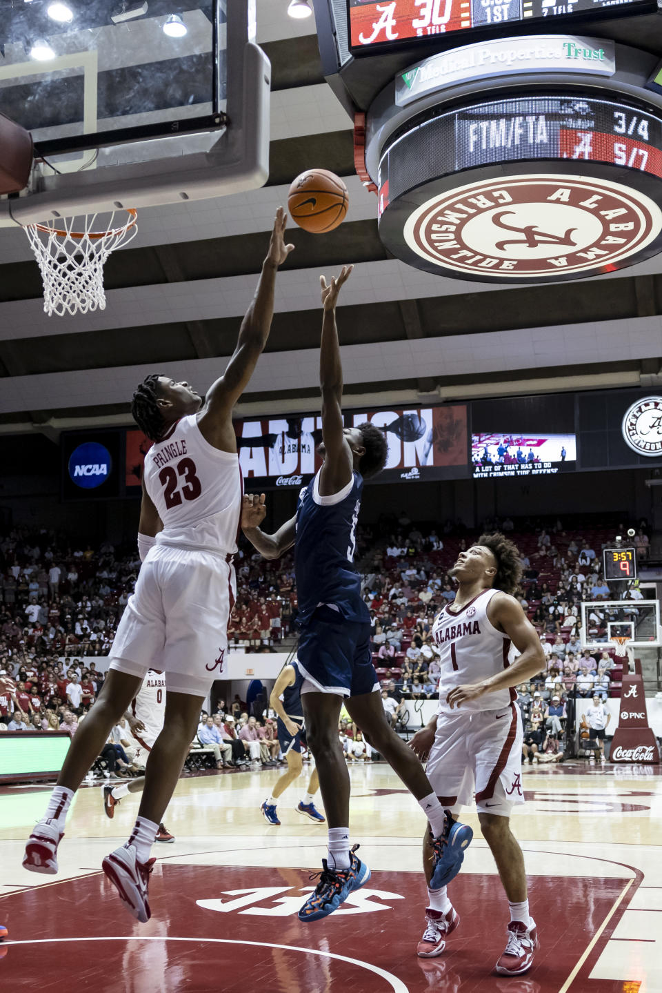 Alabama forward Nick Pringle (23) blocks a shot from Longwood guard Jaylani Darden (5) during the first half of an NCAA college basketball game Monday, Nov. 7, 2022, in Tuscaloosa, Ala. (AP Photo/Vasha Hunt)