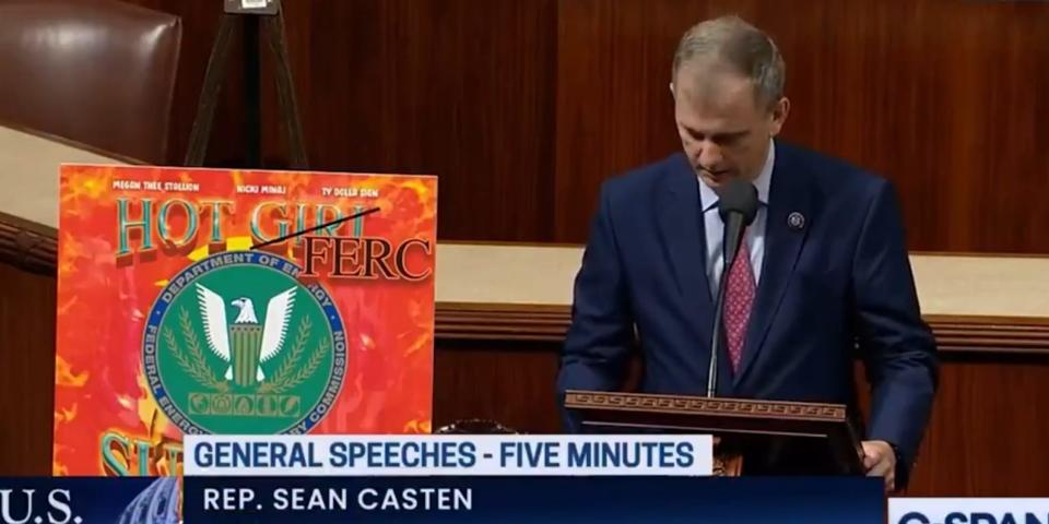 Sean Casten showing off a congressional floor chart that says "Hot FERC Summer"
