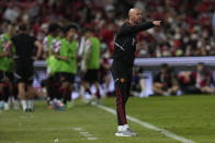 Manchester United's head coach Erik ten Hag gives instructions to his players during their during their pre-season soccer match against Liverpool at Rajamangala national stadium in Bangkok, Tuesday, July 12, 2022. Manchester United beat Liverpool 4-0.(AP Photo/Sakchai Lalit)