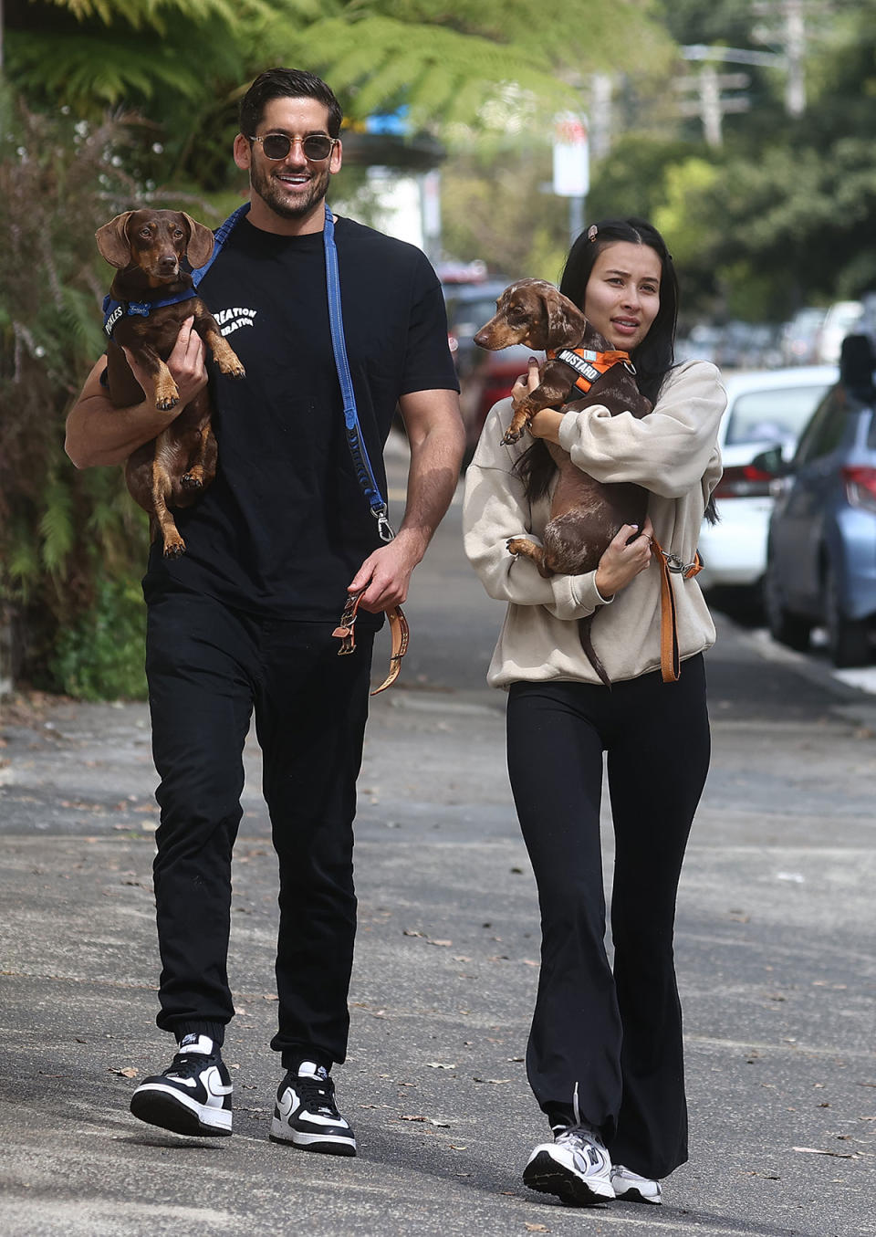 Duncan and Evelyn holding their dogs