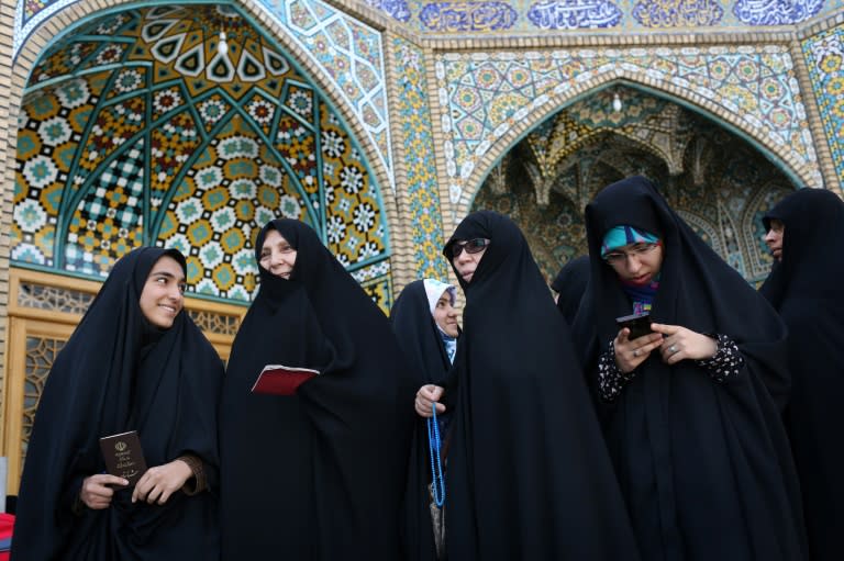 Women prepare to vote in Iran's presidential election in the Shiite Muslim holy city of Qom on May 19, 2017