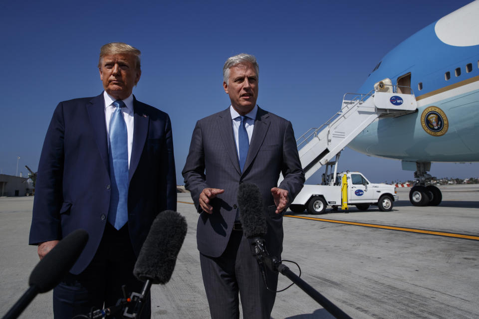 President Donald Trump and new national security adviser Robert O'Brien talk with reporters before boarding Air Force One at Los Angeles International Airport, Wednesday, Sept. 18, 2019, in Los Angeles. (AP Photo/Evan Vucci)