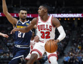 Chicago Bulls guard Kris Dunn (32) works against Denver Nuggets guard Jamal Murray (27) in the second half of an NBA basketball game, Thursday, Jan. 17, 2019, in Denver. The Nuggets won 135-105. (AP Photo/David Zalubowski)