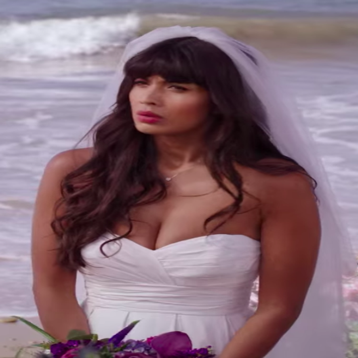 Tahani wearing a strapless dress