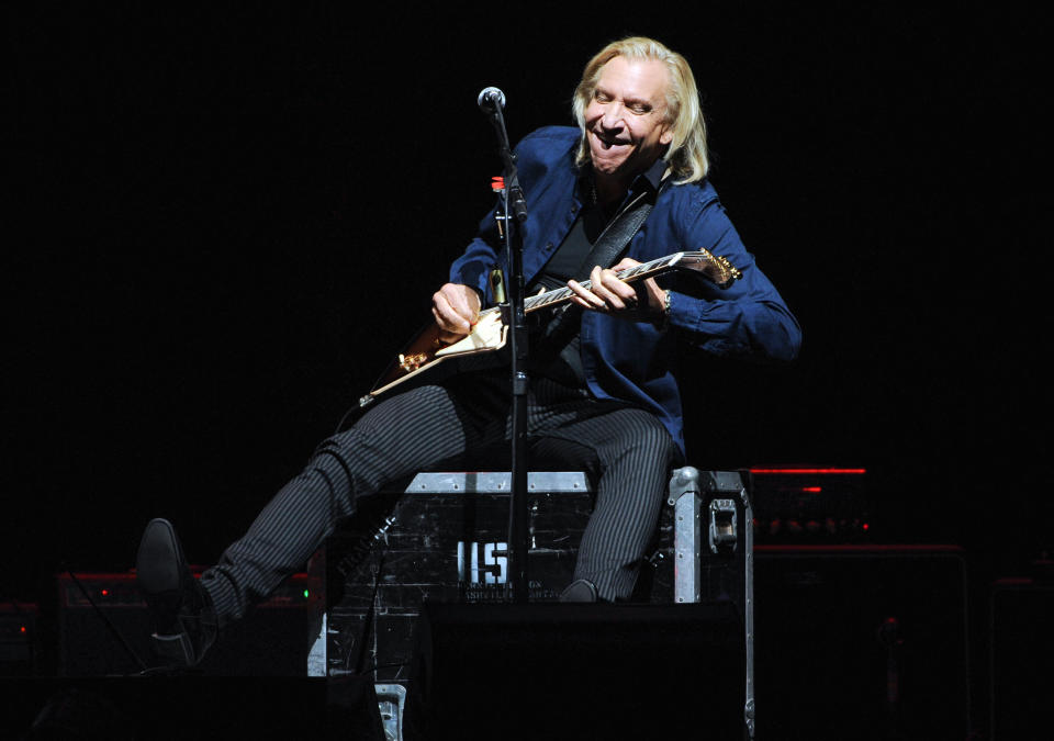 Musician Joe Walsh of the Eagles performs at Madison Square Garden on Friday, Nov. 8, 2013 in New York. (Photo by Evan Agostini/Invision/AP)