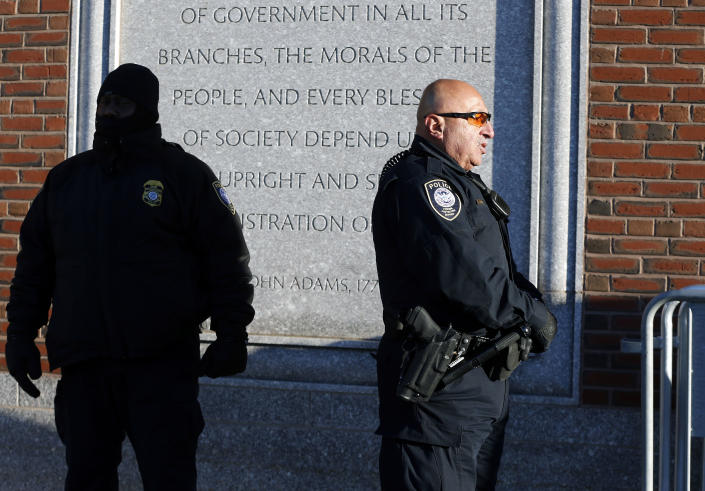 Police officers stand outside the federal courthouse in Boston, Monday, Jan. 5, 2015, for the first day of jury selection in the trial of Boston Marathon bombing suspect Dzhokhar Tsarnaev. (AP Photo/Michael Dwyer)