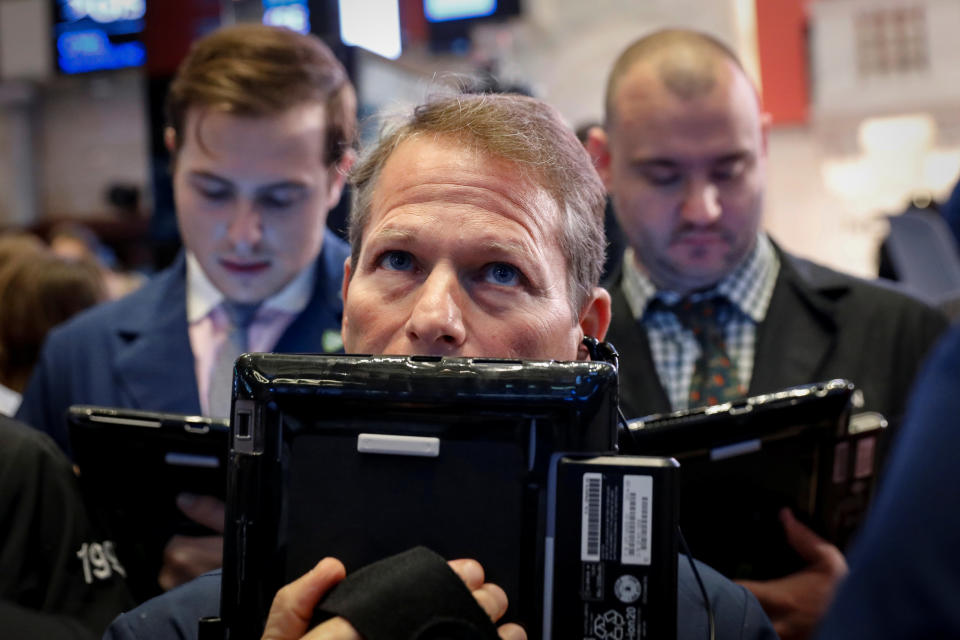 Traders work on the floor of the New York Stock Exchange (NYSE) in New York, U.S., September 20, 2018. REUTERS/Brendan McDermid