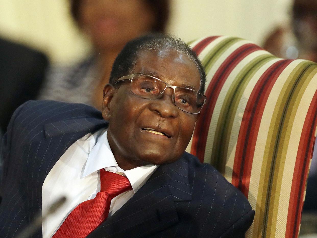 Zimbabwean President Robert Mugabe has long been criticised at home for going overseas for medical treatment and for presiding over the collapse of his country's healthcare system: AP/Themba Hadebe