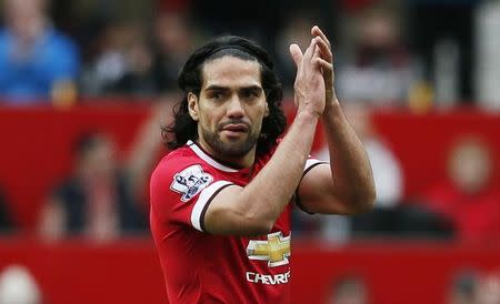 Manchester United's Radamel Falcao applauds fans as he is substituted. Reuters / Phil Noble