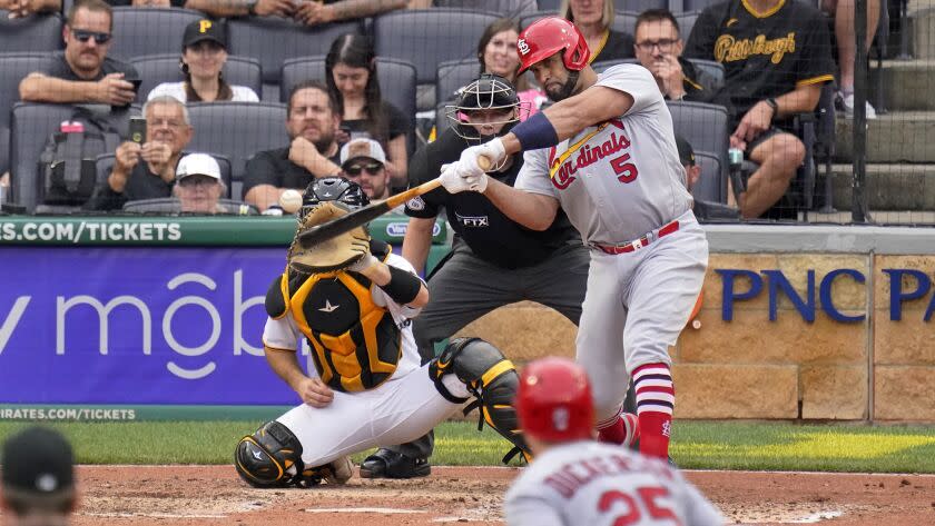 St. Louis Cardinals' Albert Pujols (5) hits a two-run home run off Pittsburgh Pirates relief pitcher Chase De Jong.