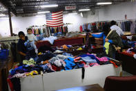 READING, PA - OCTOBER 20: Women shop for clothes at a thrift store on October 20, 2011 in Reading, Pennsylvania. Reading, a city that once boasted numerous industries and the nation's largest railroad company, has recently been named America's poorest city with residents over 65,000. According to new census data, 41.3 percent of people live below the poverty line in Reading. Reading has about 90,000 residents, many of whom are recent Hispanic arrivals who have moved from larger eastern cities over the past decade. While a manufacturing base offering well paying jobs still exists in Reading, many companies like Hershey, Stanley Tool and Dana Systems have either moved elsewhere in the United States or to Mexico in search of cheaper labor. The number of people living in poverty in America, 46.2 million, is now at its highest level for the 52 years the Census Bureau has been keeping records. (Photo by Spencer Platt/Getty Images)