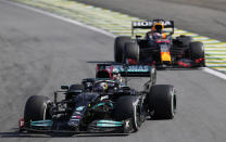 Mercedes' Lewis Hamilton, front, steers his car followed by Red Bull's Max Verstappen , during the Brazilian Formula One Grand Prix at the Interlagos race track in Sao Paulo, Brazil, Sunday, Nov. 14, 2021. (AP Photo/Andre Penner)