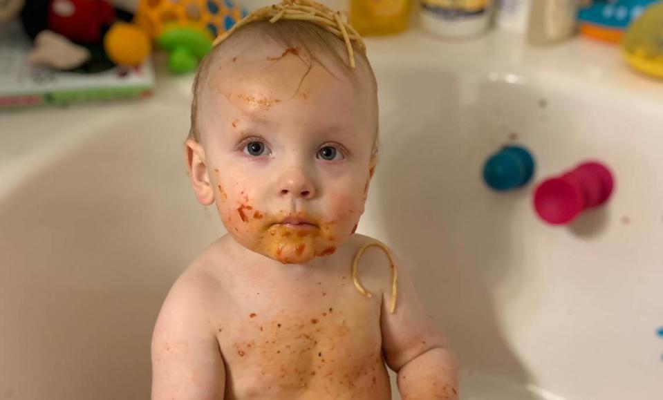 Jackson Moore, covered in spaghetti, prepares for a bath in October 2020.