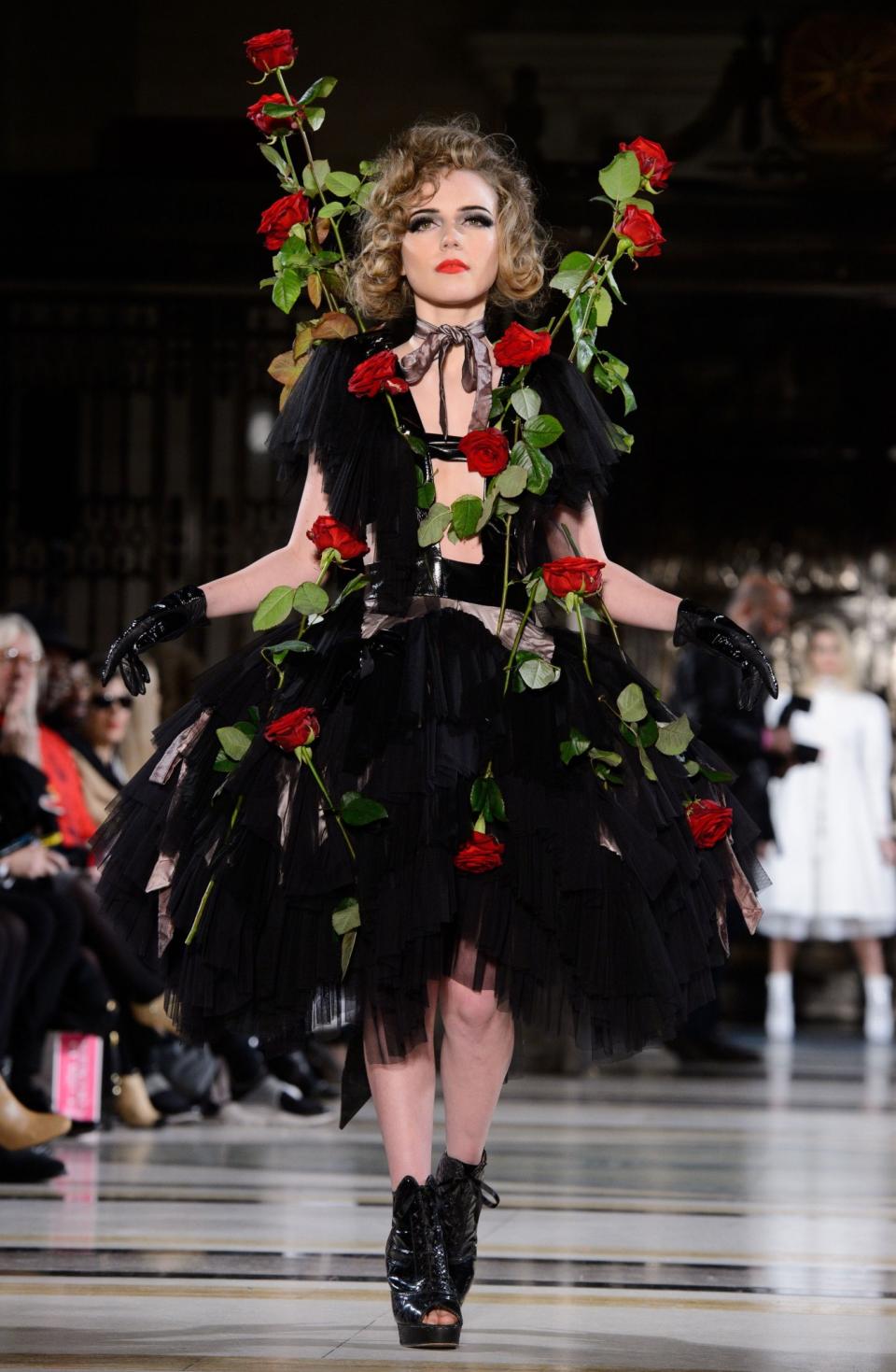 <p>Real-live roses on your dress? Pretty, but possibly a bit impractical. [Photo: Rex] </p>