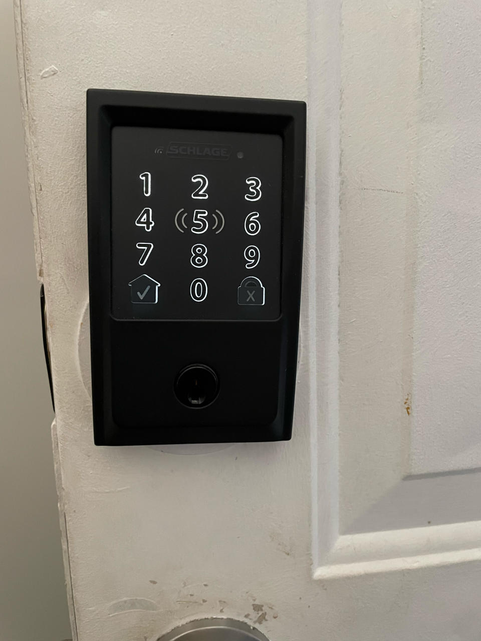 Schalge smart lock mounted to door, smart locks