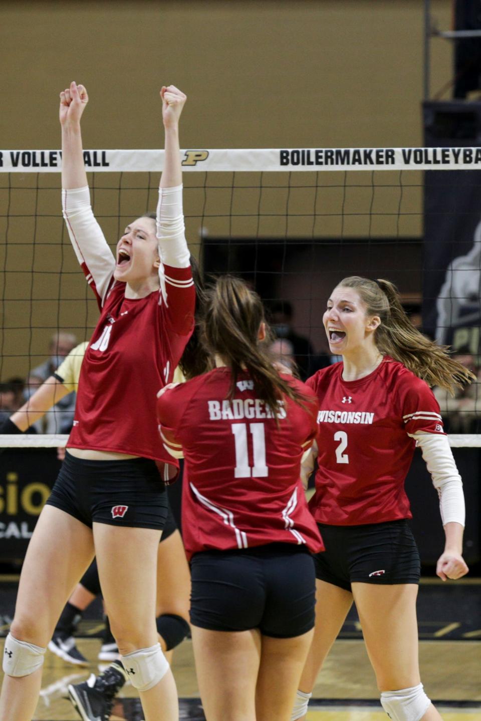 Wisconsin players celebrate a point during the second set of an NCAA women's volleyball game, Sunday, Oct. 31, 2021 at Holloway Gymnasium in West Lafayette.