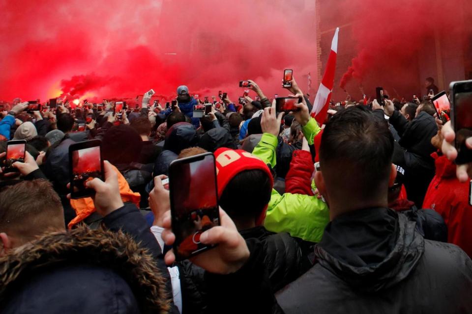 Flares were let off outside the ground ahead of the game (REUTERS)