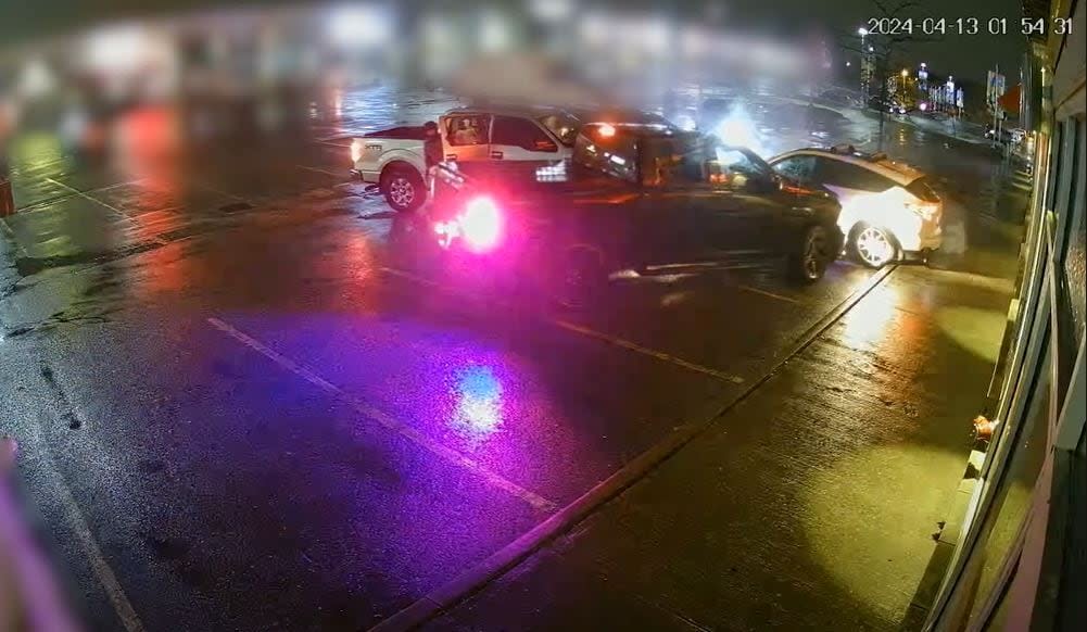 York Regional Police released this security camera footage Friday of police vehicles surrounding a stolen vehicle. (York Regional Police - image credit)