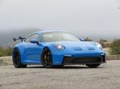 <p>"Here’s the headline: the 992 GT3 is bigger in every dimension than the old car, makes no more power than the old car, and has either the seven-speed PDK or the six-speed manual from the old car. And yet, it’s substantially faster, to the tune of 17 seconds a lap around the Nordschleife. Somebody, as the kids say, has been Doing Science." - <em><a href="https://www.roadandtrack.com/new-cars/first-drives/a36178330/2022-porsche-911-gt3-first-drive/" rel="nofollow noopener" target="_blank" data-ylk="slk:R&T April 2021;elm:context_link;itc:0;sec:content-canvas" class="link ">R&T April 2021</a></em></p><ul><li><strong>Price: </strong>$162,450 (base)</li><li><strong>Engine: </strong>4.0-liter flat-six</li><li><strong>Output: </strong>502 hp/346 lb-ft</li><li><strong>Transmission: </strong>6-speed manual</li><li><strong>Curb Weight: </strong>3126 lb </li></ul>