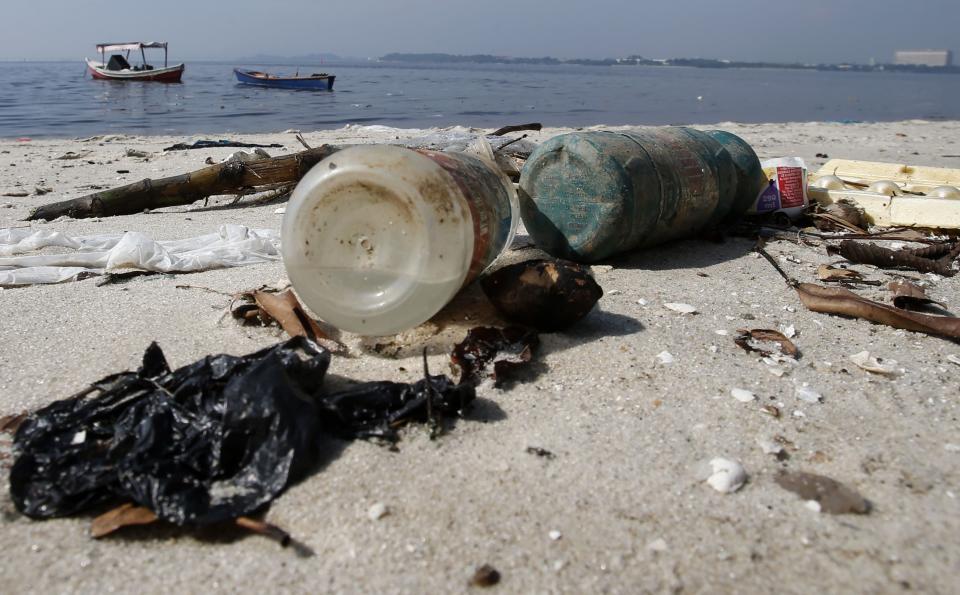 Bottles of plastic are seen on Galeao beach in the Guanabara Bay in Rio de Janeiro