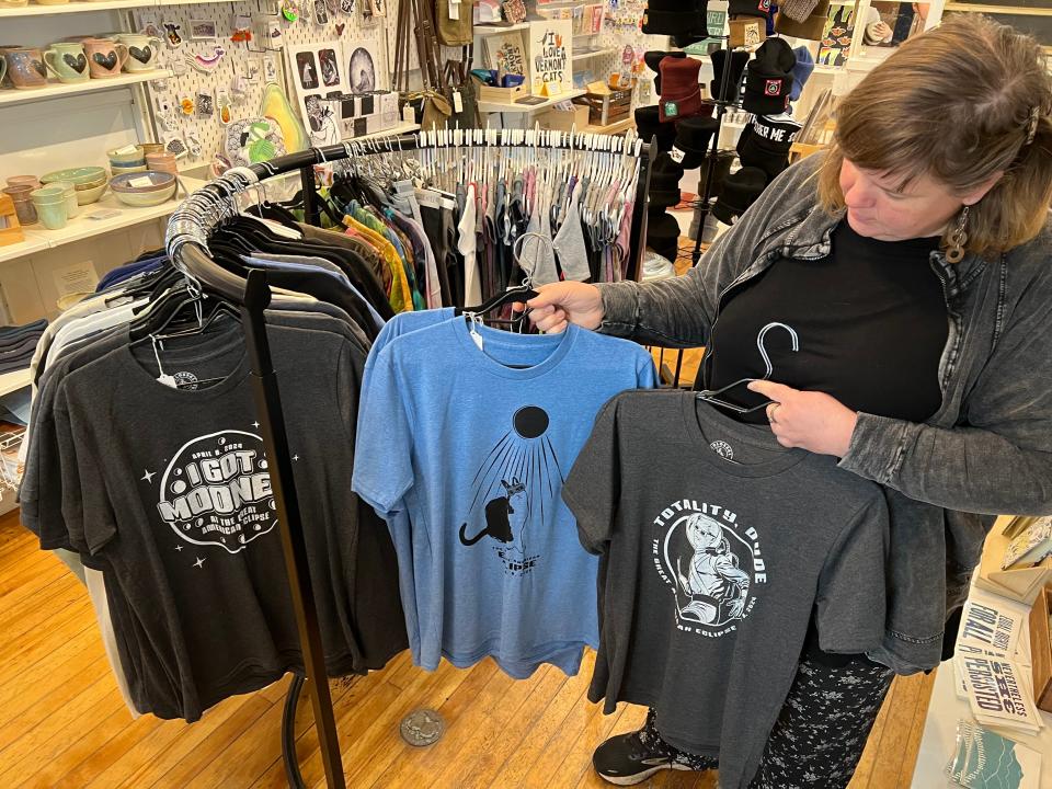 Putting the comic into cosmic: three shirts created by Colossal Sanders to celebrate the total solar eclipse on April 8. The shirts were being sold by Thirty-Odd in Burlington on March 15, 2024.