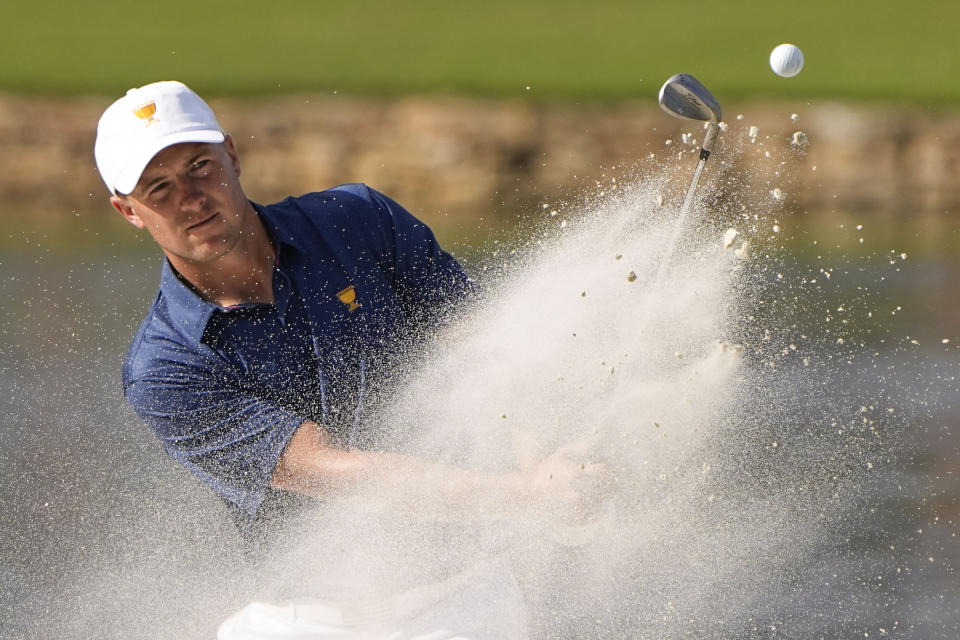 Jordan Spieth hits out of bunker on the 14th hole during their fourball match at the Presidents Cup golf tournament at the Quail Hollow Club, Saturday, Sept. 24, 2022, in Charlotte, N.C. (AP Photo/Chris Carlson)