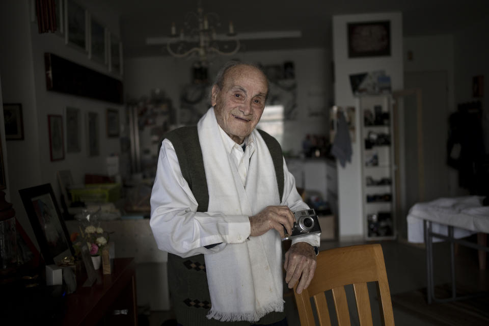 Gad Partok, 93, a Tunisian-born Holocaust survivor, poses for a portrait in his home in Ashkelon, southern Israel, Friday, Jan. 26, 2024. He never thought he'd have to relive the horrors of the Nazi onslaught that claimed the lives of his father and two brothers.Then, on Oct. 7, he watched on TV from his living room as Israeli news channels played videos of Hamas militants tearing through communities just a few kilometers (miles) from where he lives. He took cover as rocket fire from Gaza pounded Ashkelon, the southern Israeli city he moved to after emigrating from Tunisia in 1947 (AP Photo/Maya Alleruzzo)