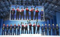 Gold medallists (C) Canada's Brad Jacobs, Ryan Fry, E.J. Harnden, Ryan Harnden and Caleb Flaxey, silver medallists (L) Britain's David Murdoch, Greg Drummond, Scott Andrews, Michael Goodfellow and Tom Brewster, bronze medallists Sweden's Niklas Edin, Sebastian Kraupp, Fredrik Lindberg, Viktor Kjaell and Oskar Eriksson celebrate during the victory ceremony for the men's curling event at the 2014 Sochi Winter Olympics in Sochi, February 22, 2104. REUTERS/Eric Gaillard (RUSSIA - Tags: SPORT CURLING OLYMPICS)