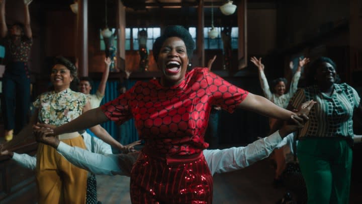 Three women happily dance in The Color Purple.