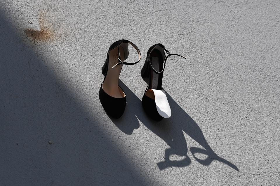 This picture taken on September 17, 2019 in Istanbul shows a part of a contemporary art installation by Turkish artist Vahit Tuna in an attempt to raise awareness on women killed by domestic violence by their partners and husbands. - Turkish artist Vahiot Tuna placed 440 pair of female shoes on the walls of a building to symbolize women killed by their partners and husbands in 2018 in Turkey. (Photo by Ozan KOSE / AFP) / RESTRICTED TO EDITORIAL USE - MANDATORY MENTION OF THE ARTIST UPON PUBLICATION - TO ILLUSTRATE THE EVENT AS SPECIFIED IN THE CAPTION        (Photo credit should read OZAN KOSE/AFP/Getty Images)