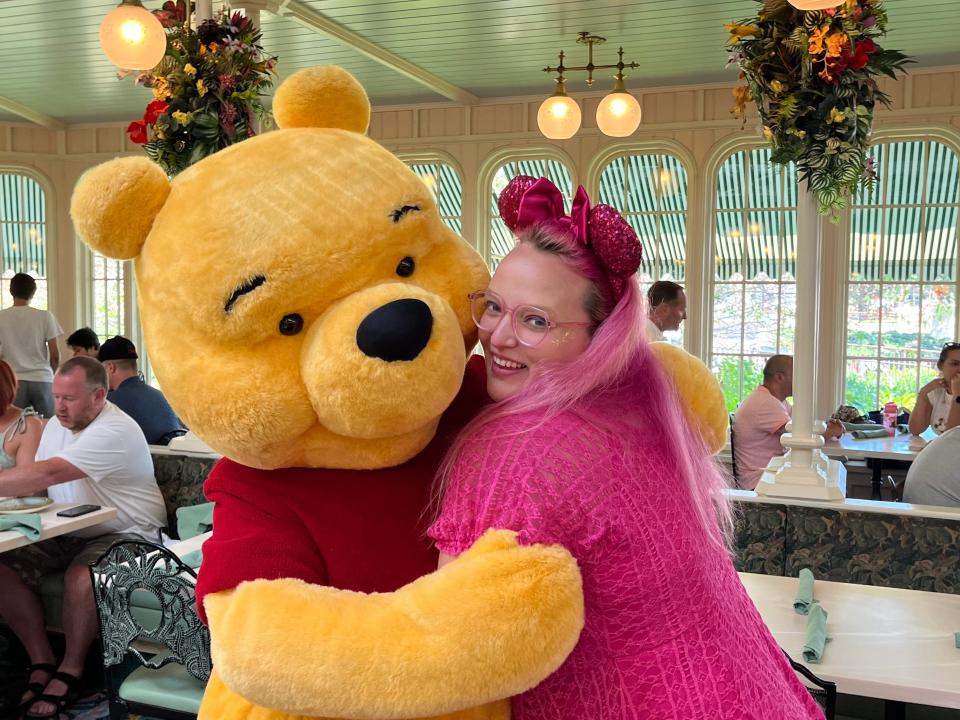 Author hugging Winnie-the-Pooh