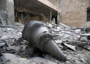 FILE - In this Wednesday, Oct. 28, 2020 file photo, a rocket front fragment lies at a newly built natal center damaged by shelling by Azerbaijan's artillery in Stepanakert, the separatist region of Nagorno-Karabakh. With Azerbaijan regaining control of land it lost to Armenian forces a quarter-century ago, civilians who fled the fighting decades ago are wondering if they can go back home now. But as Azerbaijani forces discovered when the first area was turned over Friday, Nov. 20 much of the recovered land is uninhabitable. (AP Photo, file)