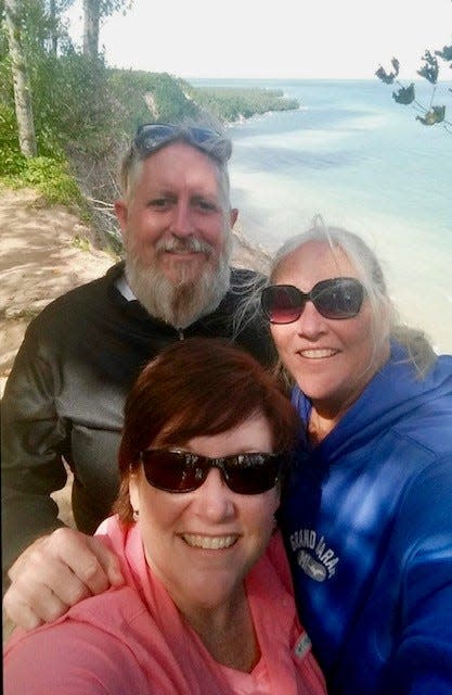 Sisters Michele Staats Feldmann, front, and Teresa Sager, right, vacationed with their brother along the Pictured Rocks National Lakeshore in Michigan's Upper Peninsula.