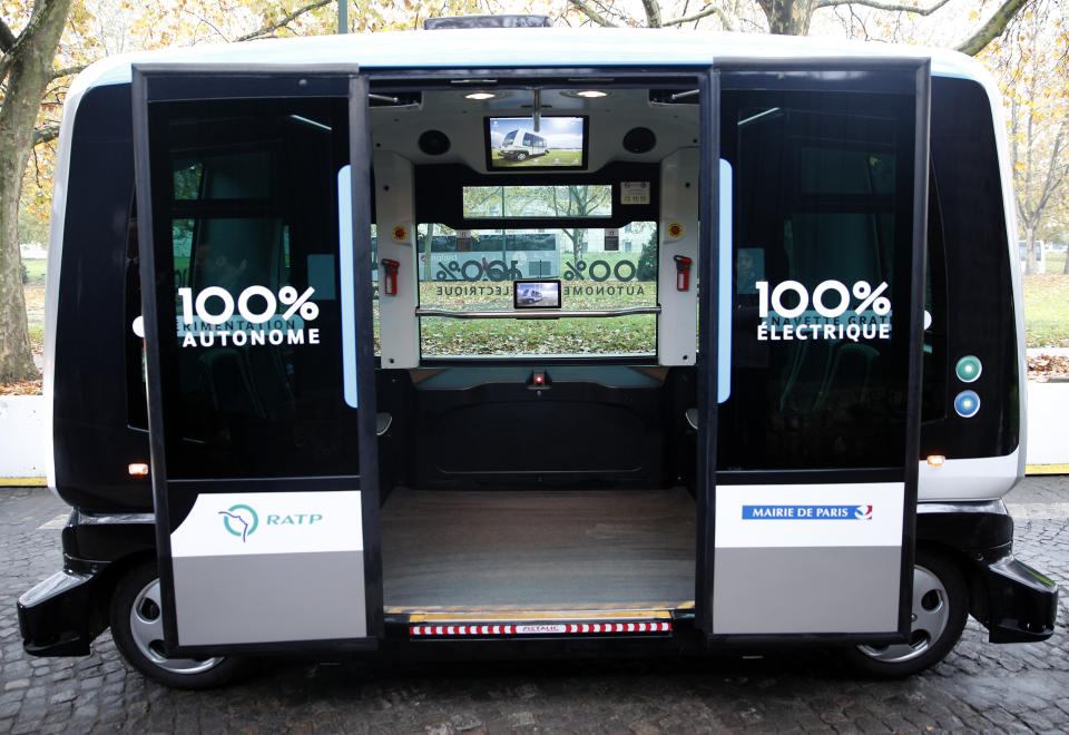 FILE - This Nov. 17, 2017, file photo shows a view inside an electric driverless shuttle produced by EasyMile, during an experiment, in Paris. The U.S. government's highway safety agency has ordered an autonomous shuttle company to stop carrying passengers in 16 U.S. cities after a mysterious braking problem occurred in Columbus, Ohio. The National Highway Traffic Safety Administration says the suspension will remain in place while it examines safety issues with the low-speed shuttles operated by France-based EasyMile. (AP Photo/Christophe Ena, File)