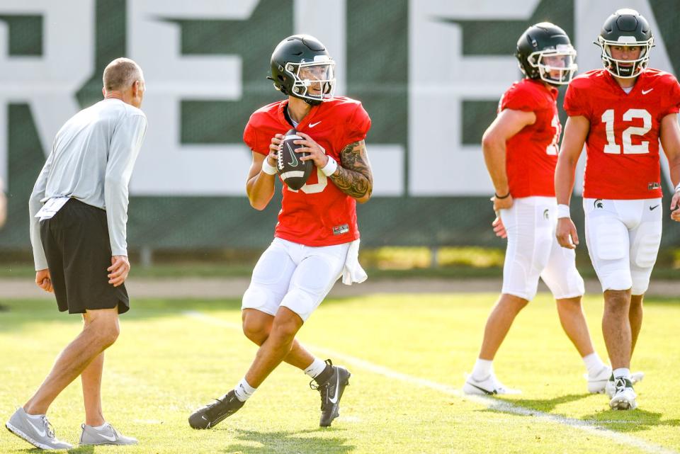 Michigan State quarterback Noah Kim drops back for a pass during football practice on Wednesday, Aug. 9, 2023, in East Lansing. Credit: Nick King/Lansing State Journal-USA TODAY NETWORK