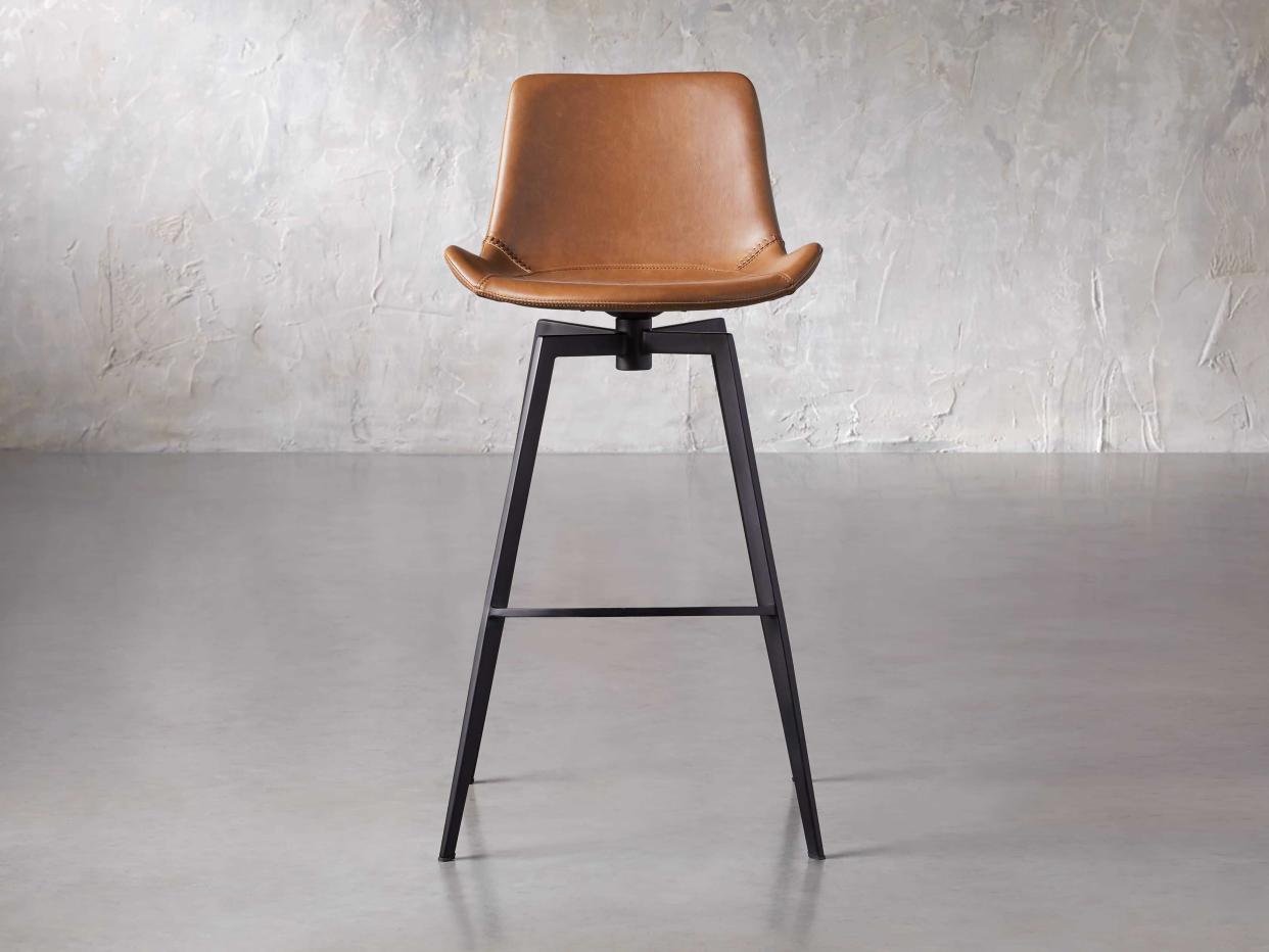 <p><a href="https://go.redirectingat.com?id=74968X1596630&url=https%3A%2F%2Fwww.arhaus.com%2Fproducts%2Fgage-faux-leather-swivel-barstool%3Fvariant%3D42682757218475&sref=https%3A%2F%2F" rel="nofollow noopener" target="_blank" data-ylk="slk:Shop Now;elm:context_link;itc:0;sec:content-canvas" class="link rapid-noclick-resp">Shop Now</a></p><p>Gage Swivel Barstool</p><p>arhaus.com</p><p>$349.00</p>