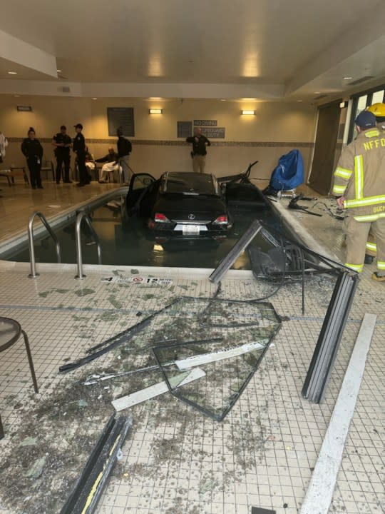 Car crashes into Seattle LA Fitness pool