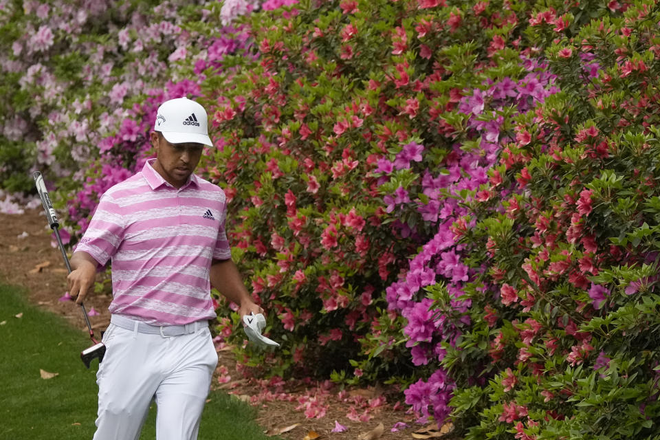 Xander Schauffele walks past azaleas on the sixth hole during the third round of the Masters golf tournament on Saturday, April 10, 2021, in Augusta, Ga. (AP Photo/Charlie Riedel)