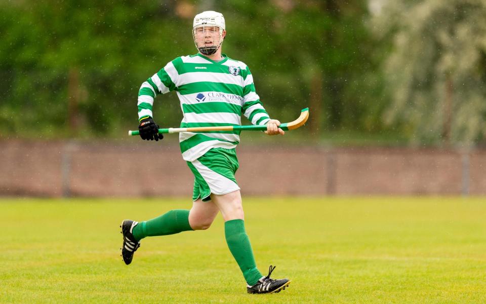 Robert MacIntyre pictured playing shinty for Oban Celtic - ALAMY STOCK PHOTO