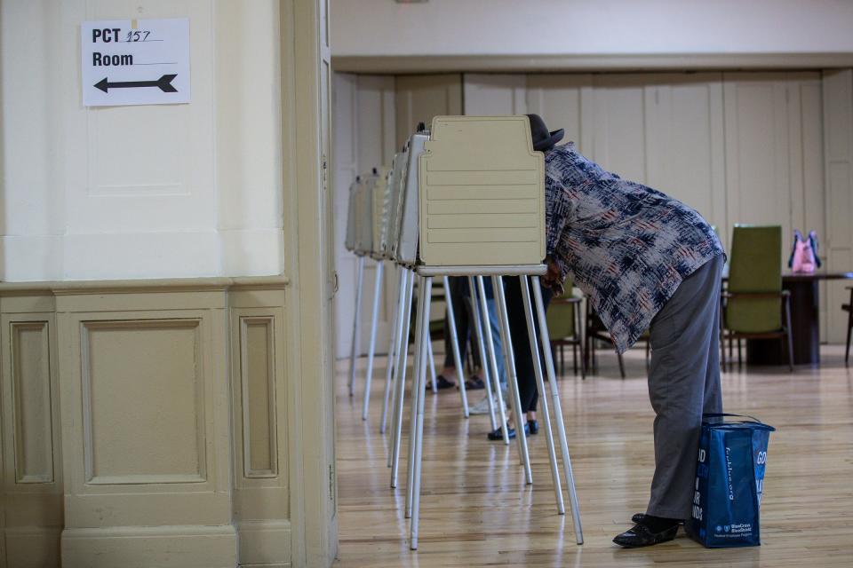 Voters cast ballots at the polling place in Central United Methodist Church in downtown Detroit, Tuesday, August 4, 2020.