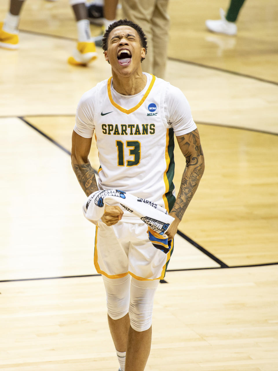 Norfolk State guard Daryl Anderson (13) reacts after his team's defeat of Appalachian State in a First Four game in the NCAA men's college basketball tournament, Thursday, March 18, 2021, in Bloomington, Ind. (AP Photo/Doug McSchooler)