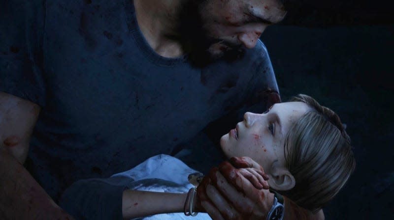 Joel holds a dead Sarah in The Last Of Us game.