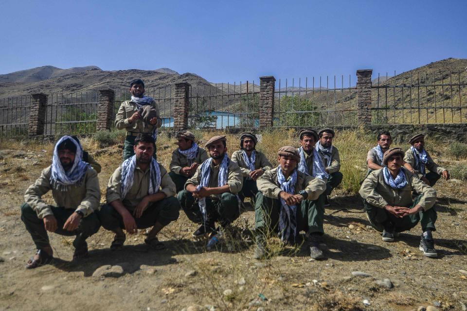 Afghan youths who would be inducted in Afghan Security forces sit along a road in Panjshir province of Afghanistan on August 15, 2021.