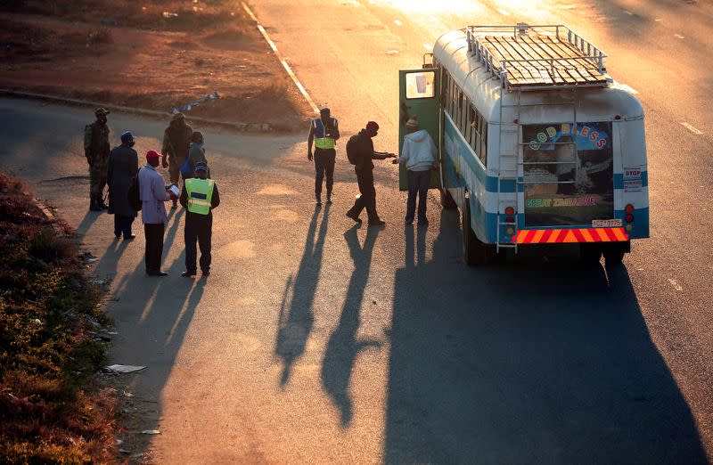 Police check bus passengers ahead of planned anti-government protests in Harare