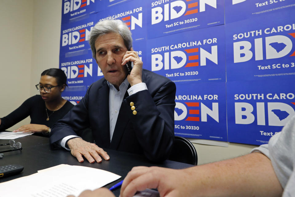 Former Secretary of State John Kerry talks to voters at a phone bank at a campaign office for Democratic presidential candidate and former Vice President Joe Biden, in Rock Hill, S.C., Wednesday, Feb. 19, 2020. (AP Photo/Gerald Herbert)